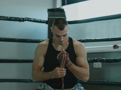 Dramatic lighting on a man preparing for a workout session