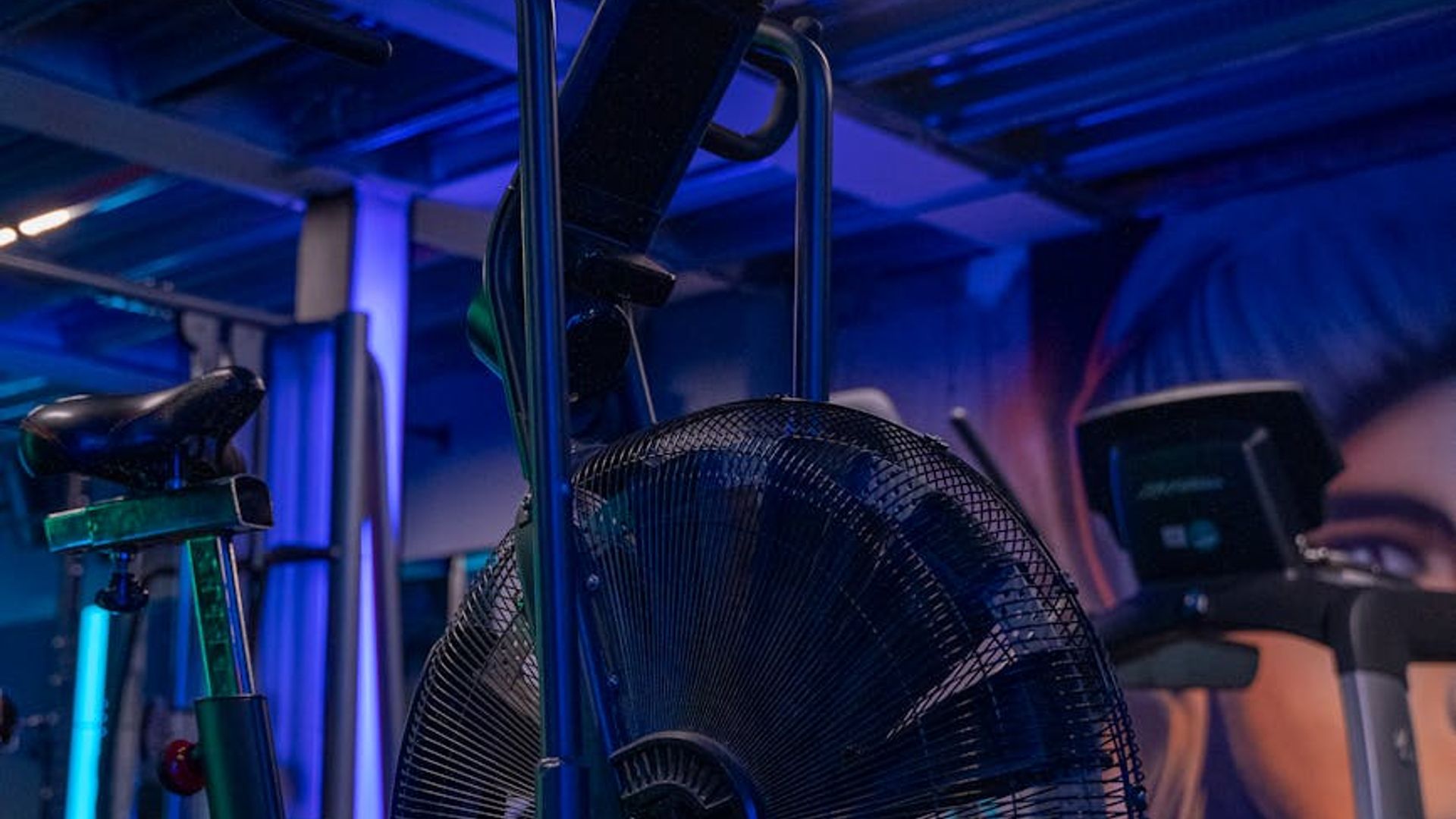 Professional gym equipment in a modern dark fitness studio